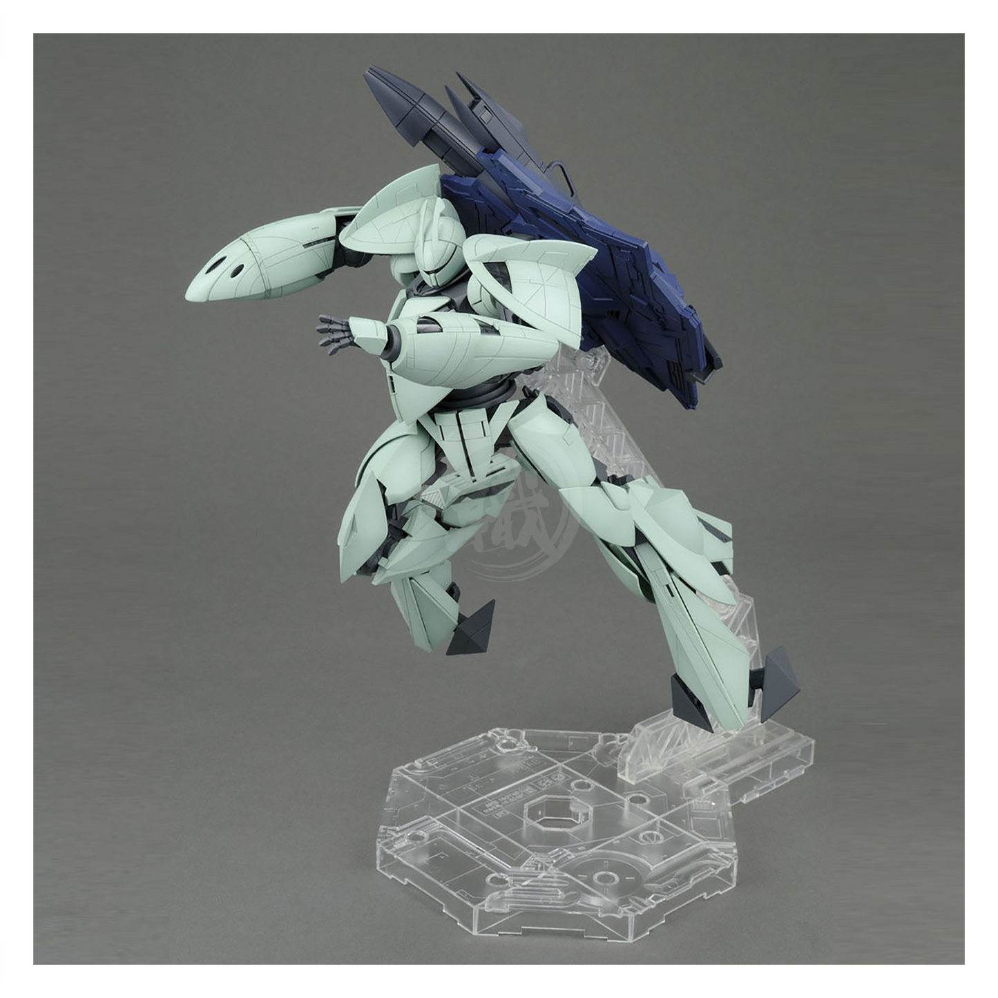 Bandai MG Turn X model kit assembled, showcasing detailed robot design with vibrant colors and intricate parts.