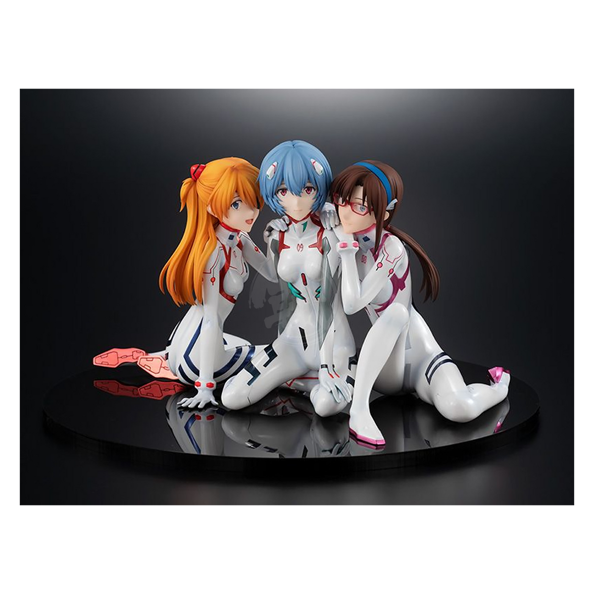 Detailed image of Asuka, Rei, and Mari figures from Good Smile Company, featuring vibrant Newtype cover design and intricate details.