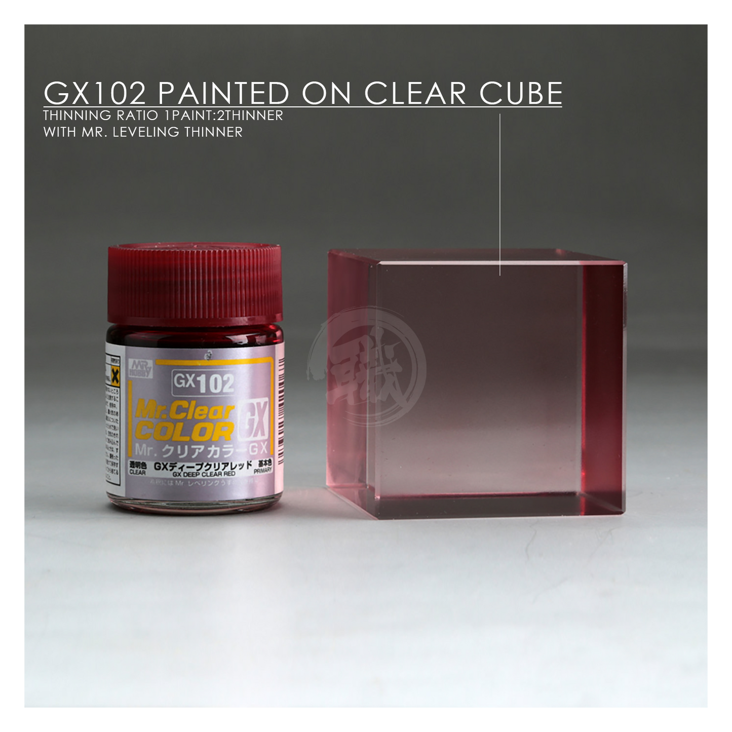 GSI Creos GX Deep Clear Red paint bottle with red liquid inside, shown with label and cap in close-up view.