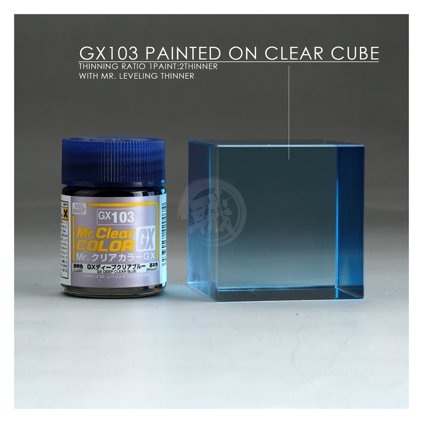 Bottle of GSI Creos GX Deep Clear Blue paint with a clear blue liquid inside, labeled GX103 for model detailing.