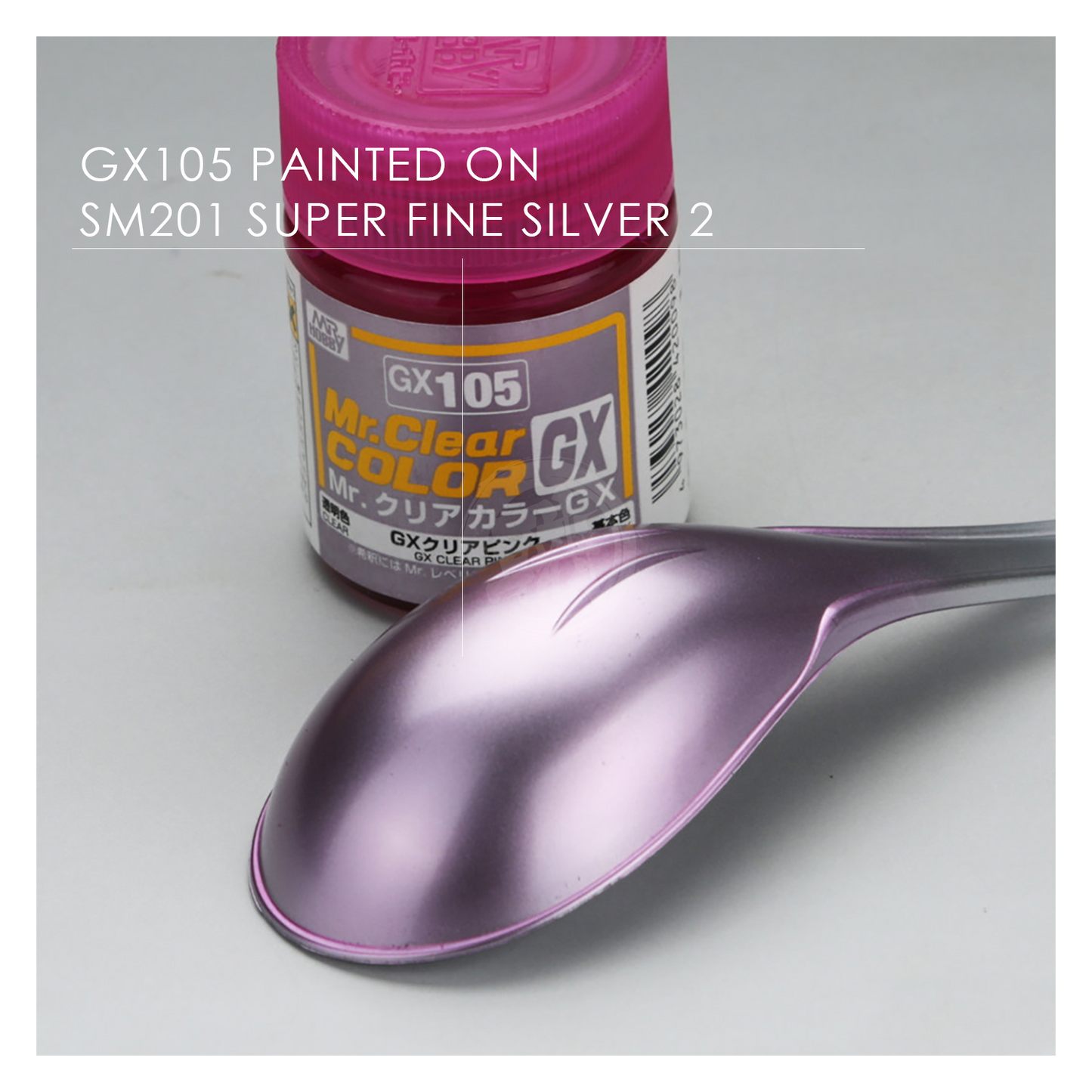 GSI Creos GX105 Clear Pink paint bottle with pink liquid inside, showcasing the vibrant paint color and label on the container.