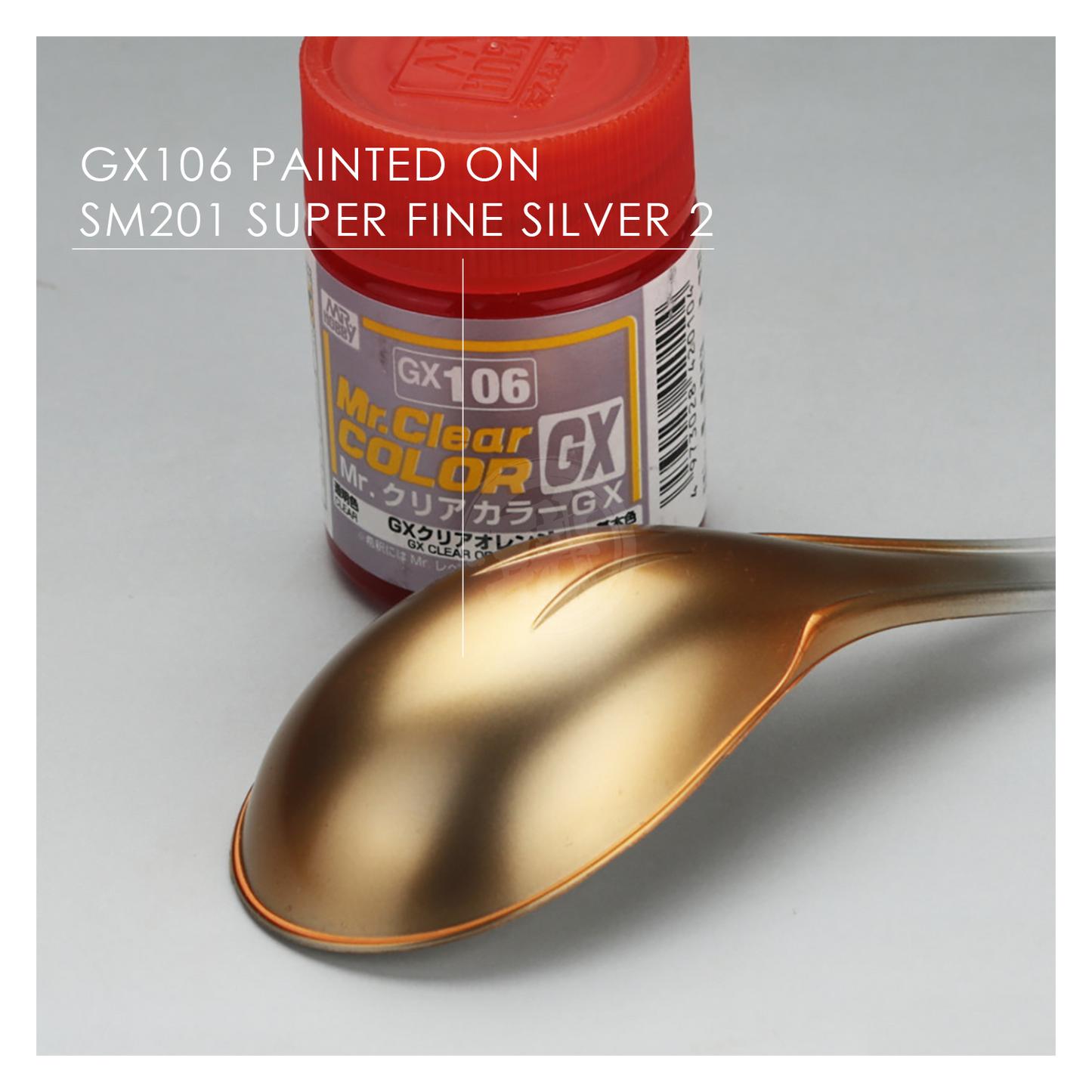 GSI Creos GX106 Clear Orange paint bottle with label, showing vibrant orange paint color and product details.