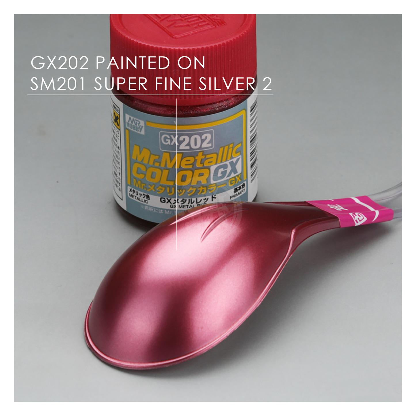 Red metal paint swatch from GSI Creos GX202 GX Metal series, showcasing vibrant red color and metallic finish.