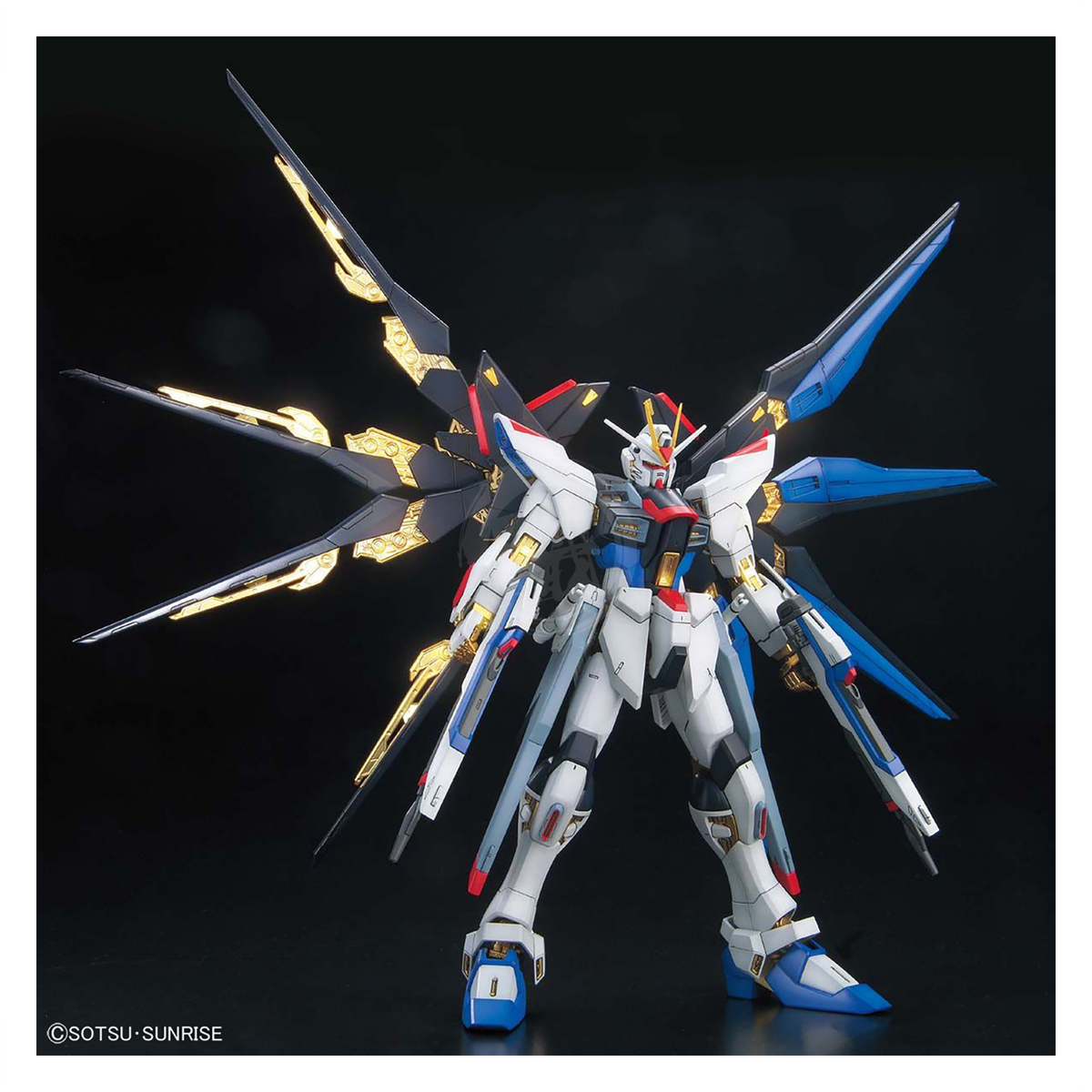 Bandai MG Strike Freedom Gundam model kit in full burst mode, featuring detailed armor and articulated limbs for display or building.