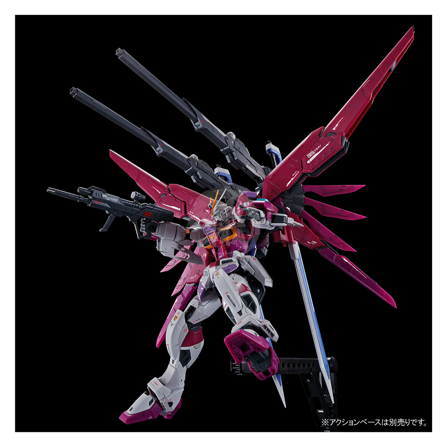 RG Destiny Impulse Gundam model kit by Bandai showing assembled robot figure with detailed armor and weapon accessories.