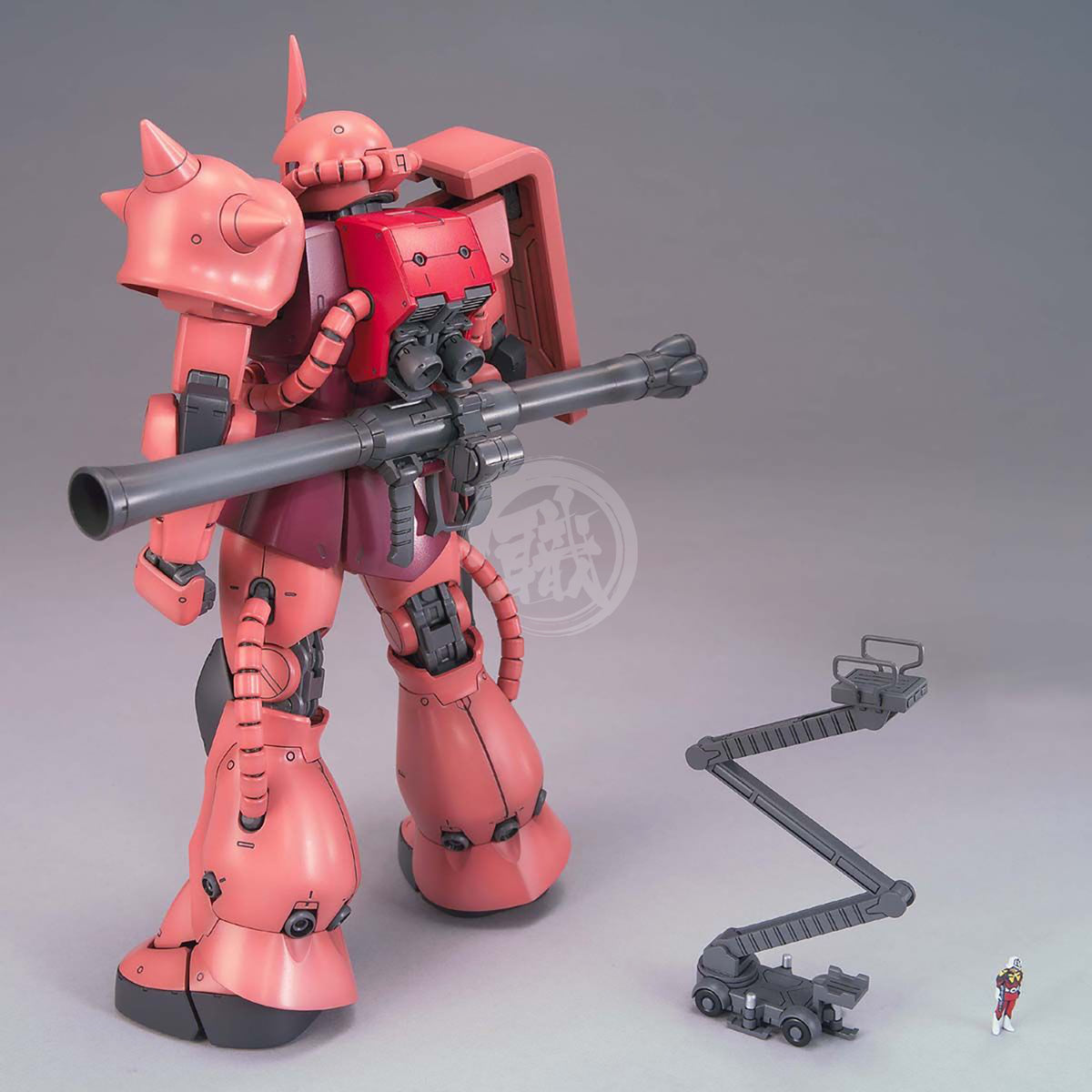 Bandai MG Zaku II Char Aznable Custom Ver. 2.0 model kit with detailed green and black plastic parts and assembly features.