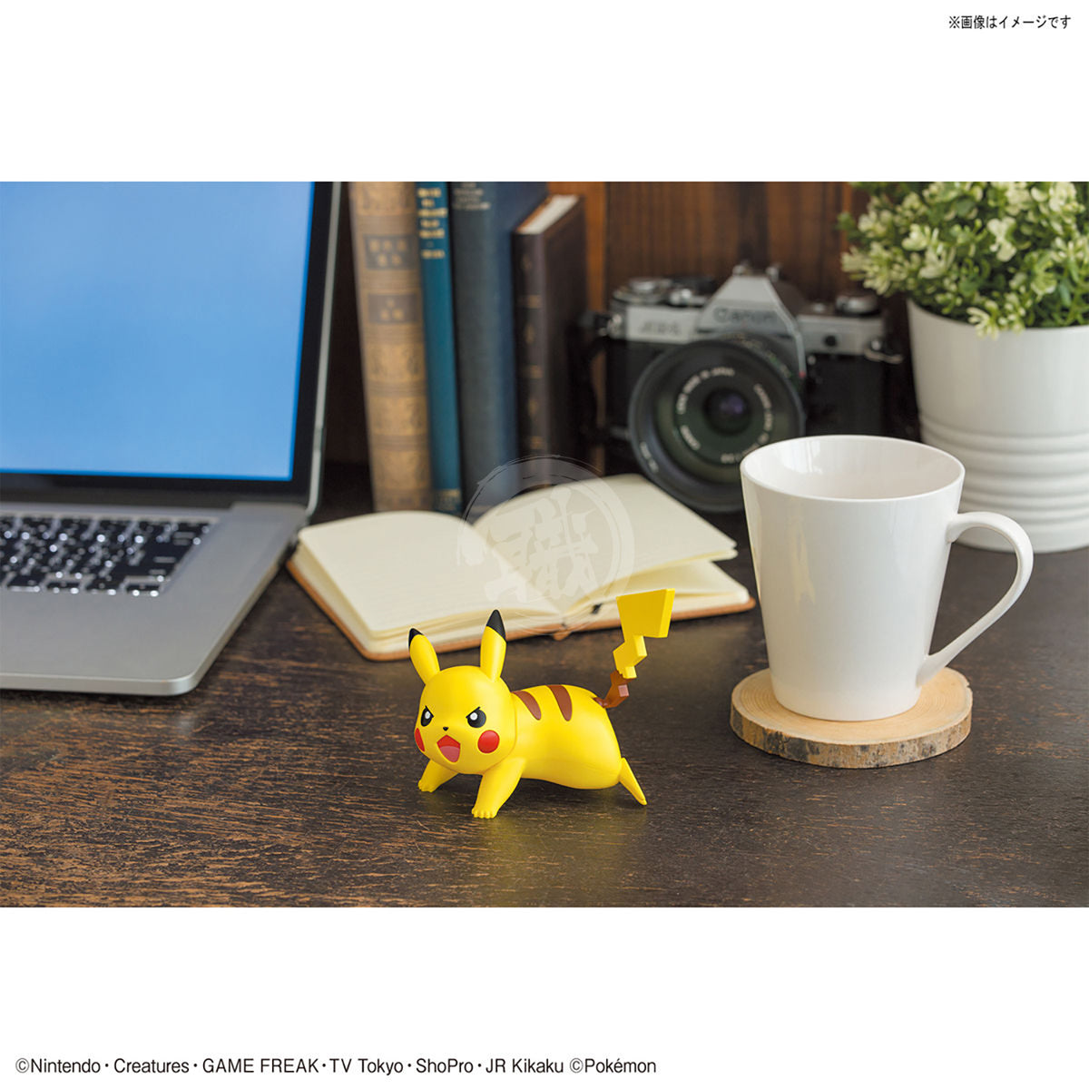 Bandai Pokepla Quick 03 Pikachu model kit in battle pose, detailed plastic figure with vibrant yellow color and dynamic stance.