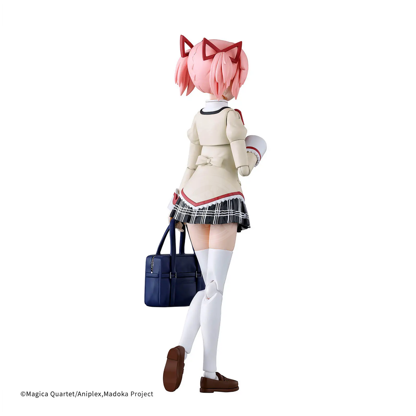 Bandai 30MP Madoka Kaname model kit in school uniform, detailed plastic figure with articulated joints and painted features.