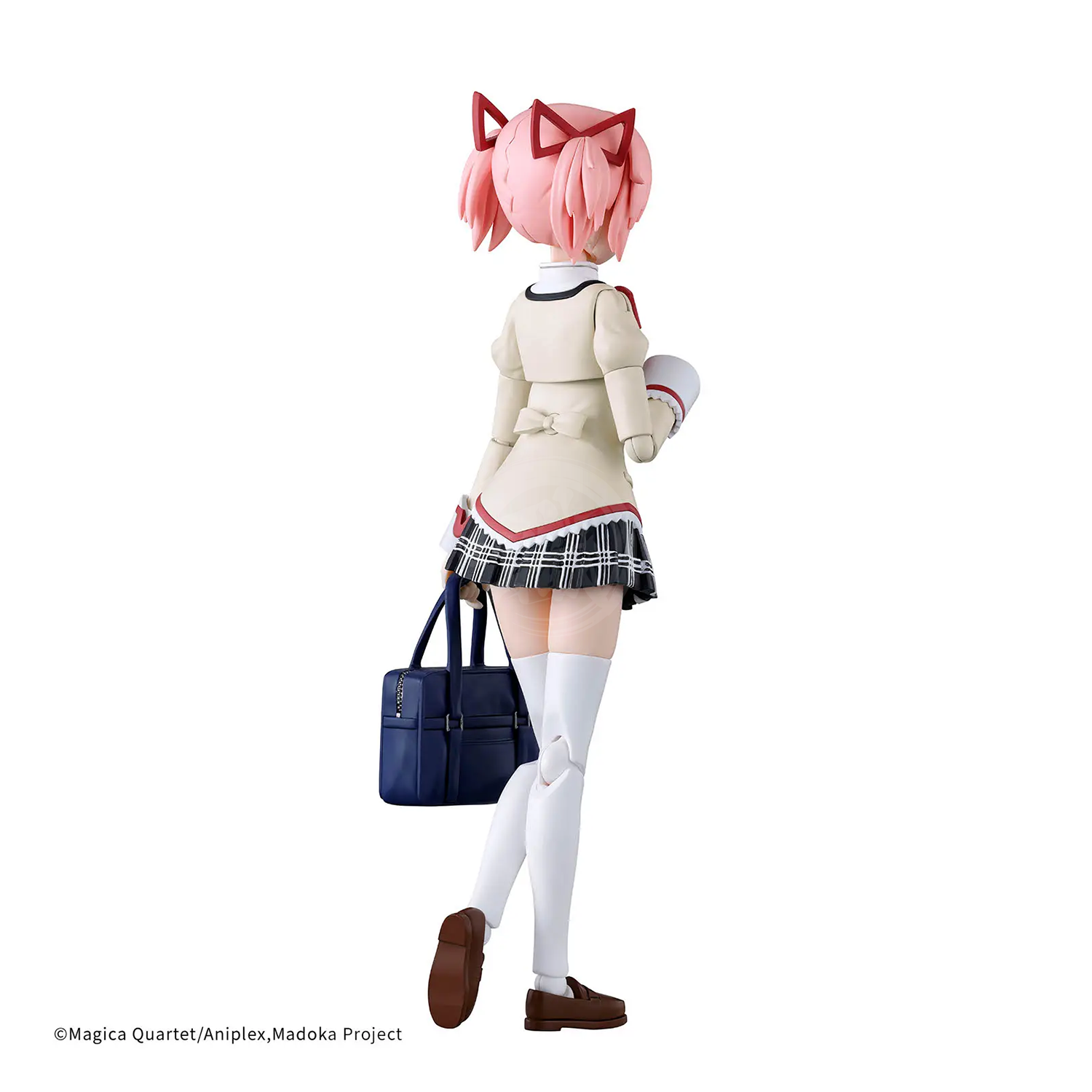 Bandai 30MP Madoka Kaname model kit in school uniform, detailed plastic figure with articulated joints and painted features.
