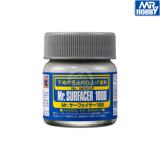 Grey Mr. Surfacer 1000 paint by GSI Creos for model finishing, shown in a container with a brush and application surface.