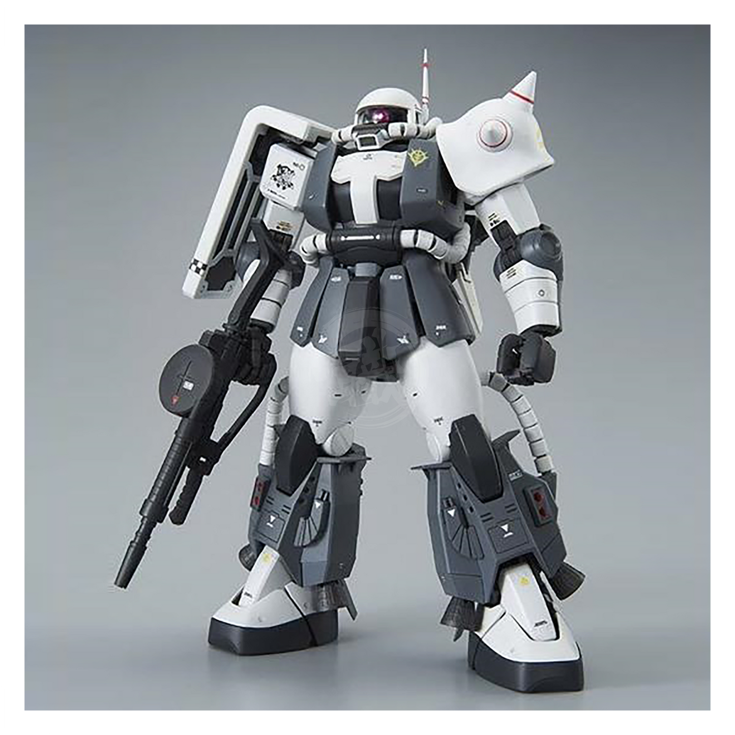 Bandai MG Zaku II High Mobility Type model kit featuring detailed custom design by Eric Manthfield, displayed in a dynamic pose.