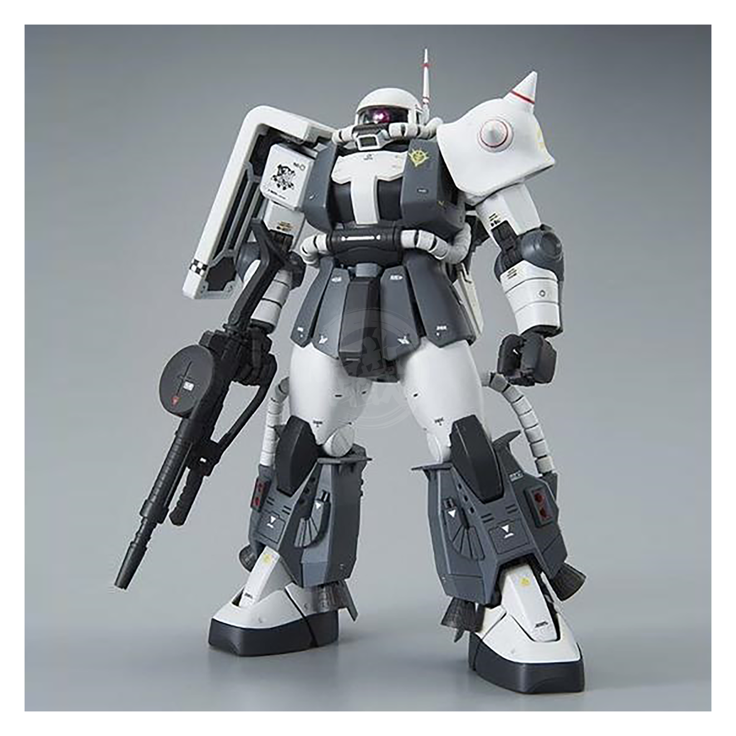Bandai MG Zaku II High Mobility Type model kit featuring detailed custom design by Eric Manthfield, displayed in a dynamic pose.