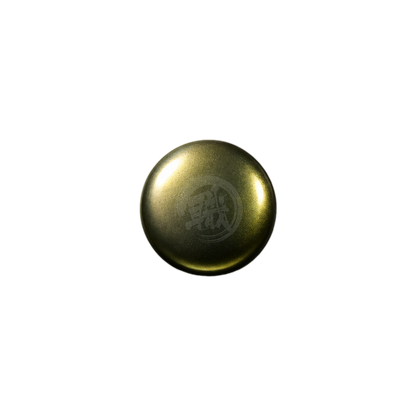Gold paint swatch from GSI Creos Topaz Gold paint series, showcasing a shiny metallic finish on a sample surface.