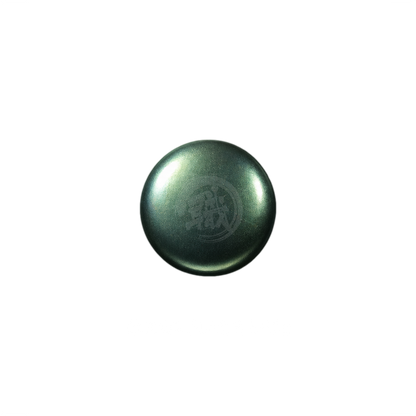 Green tourmaline paint swatch from GSI Creos XC06 series, showcasing vibrant green color and smooth paint texture.